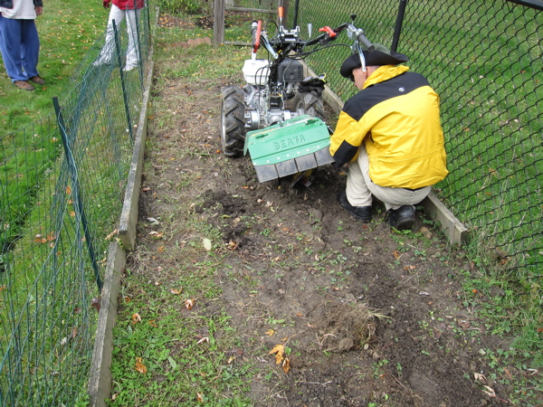 Getting Bertha ready - we used the guide to prevent dirt from being thrown into their yard.